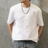 PEAK BLUE white cotton t-shirt with embossed Native American graphic motif and crew neck. Short sleeves.
