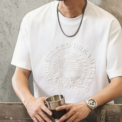 PEAK BLUE white cotton t-shirt with embossed Native American chief graphic and text.